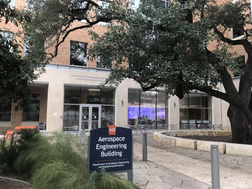 Entrance of the ASE building entrance with sign out front on UT Austin campus.