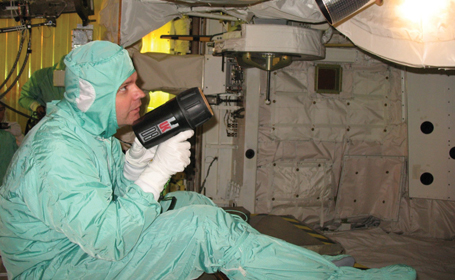 Trent Martin inspecting AMS Star Tracker