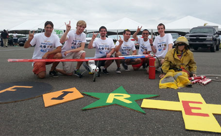 group photo of uav team at competition with aircraft