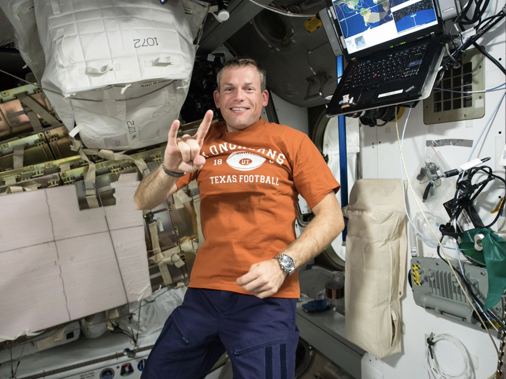 photo of Andreas Morgensen in space with longhorn shirt