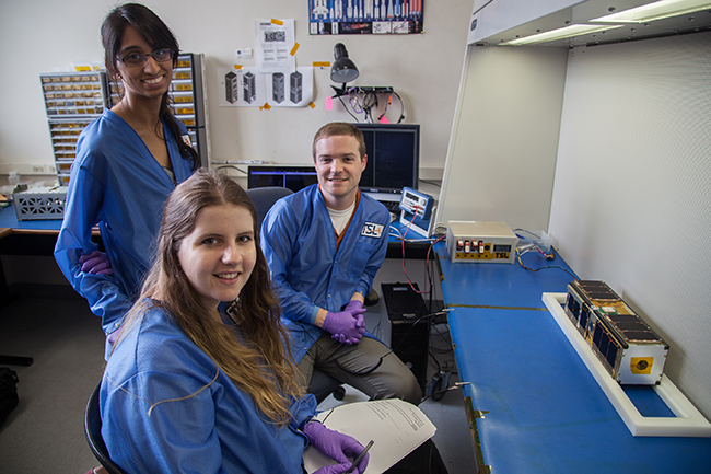 Bevo-2 team members smiling together in lab.