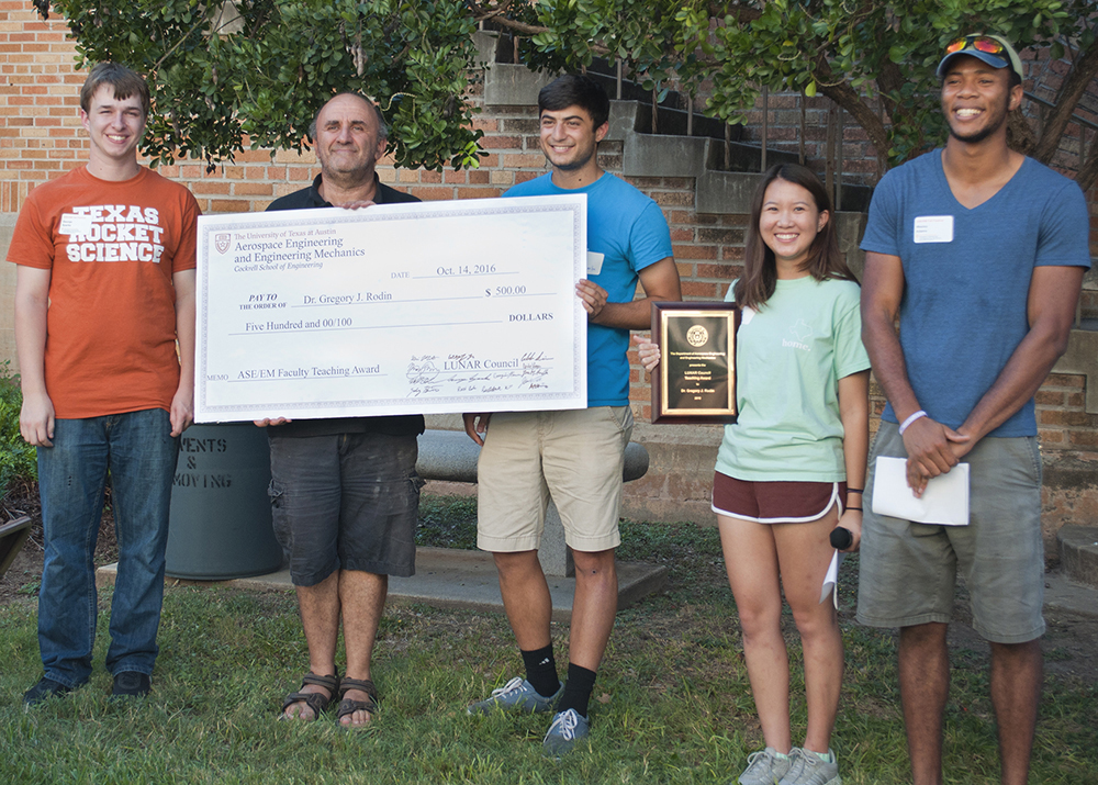 Dr. Rodin receives check