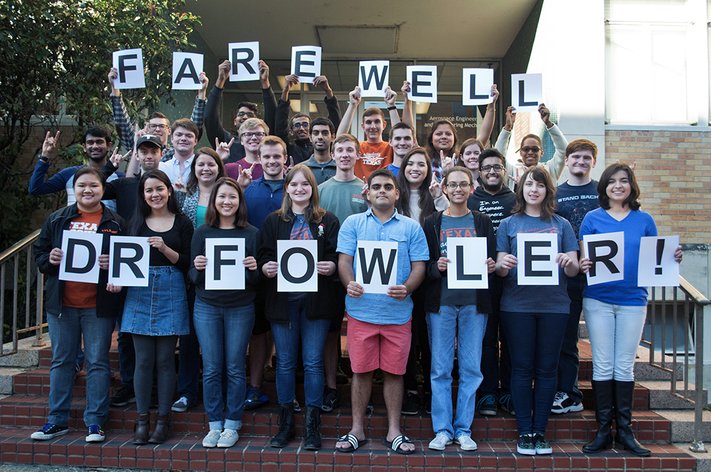 Students holding signs that read: "Farewell Fowler"