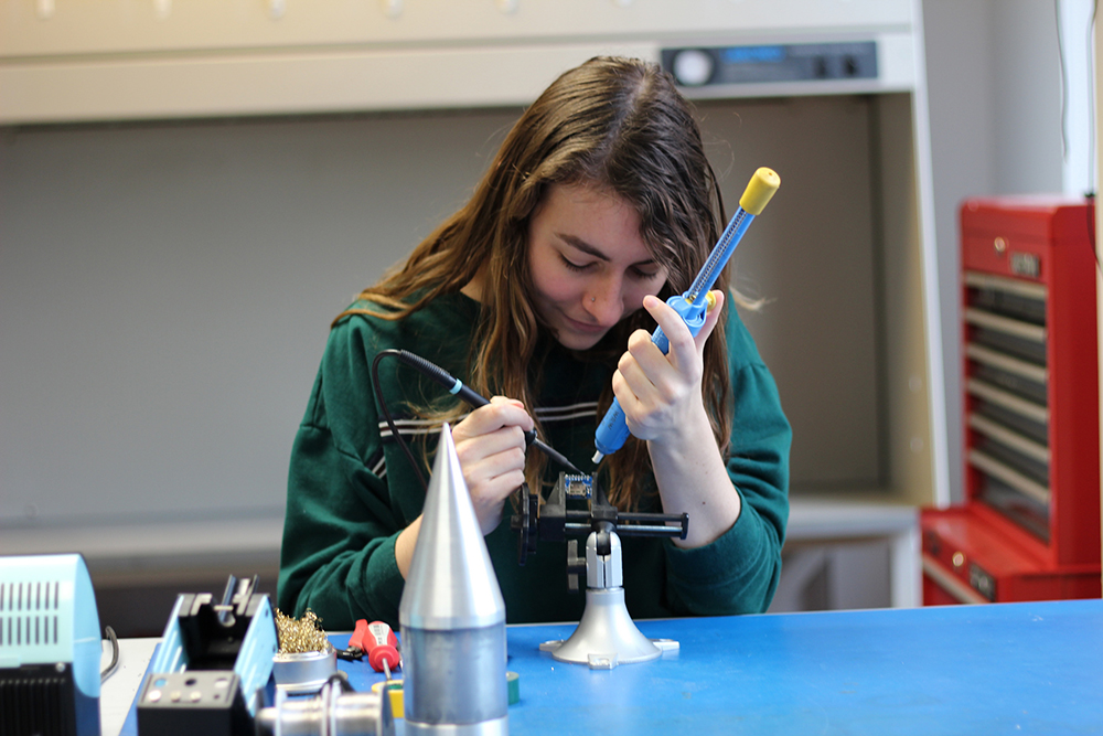 Alexis Zinni working in Texas Spacecraft Lab photo