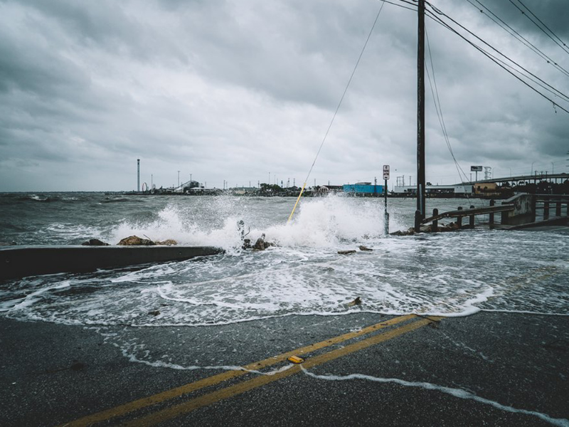 Ocean water flooding onto deserted street during storm