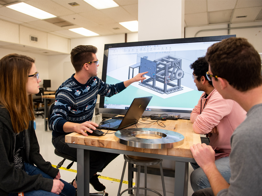 Students working in texas rocket engineering lab