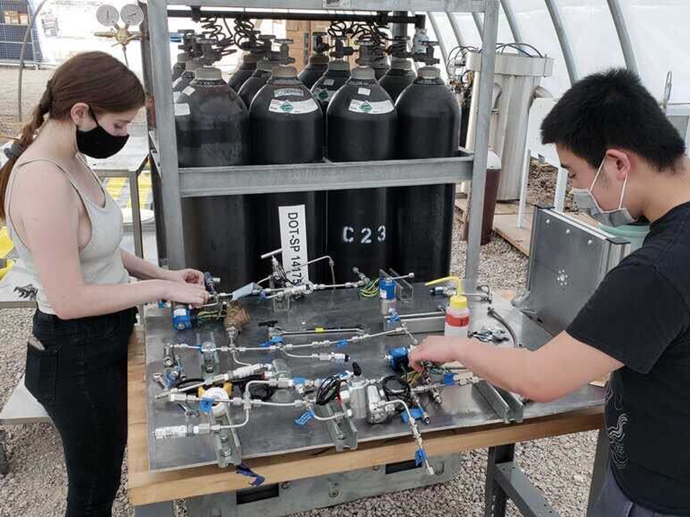 photo of students working on TREL ignitor test stand
