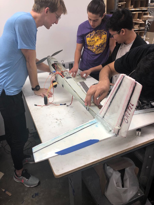 photo of dbf students working on airplane