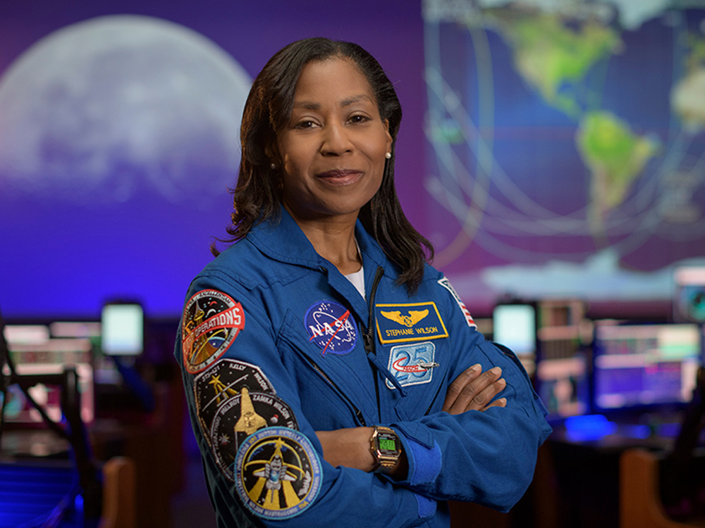 photo of astronaut stephanie wilson in flight suit