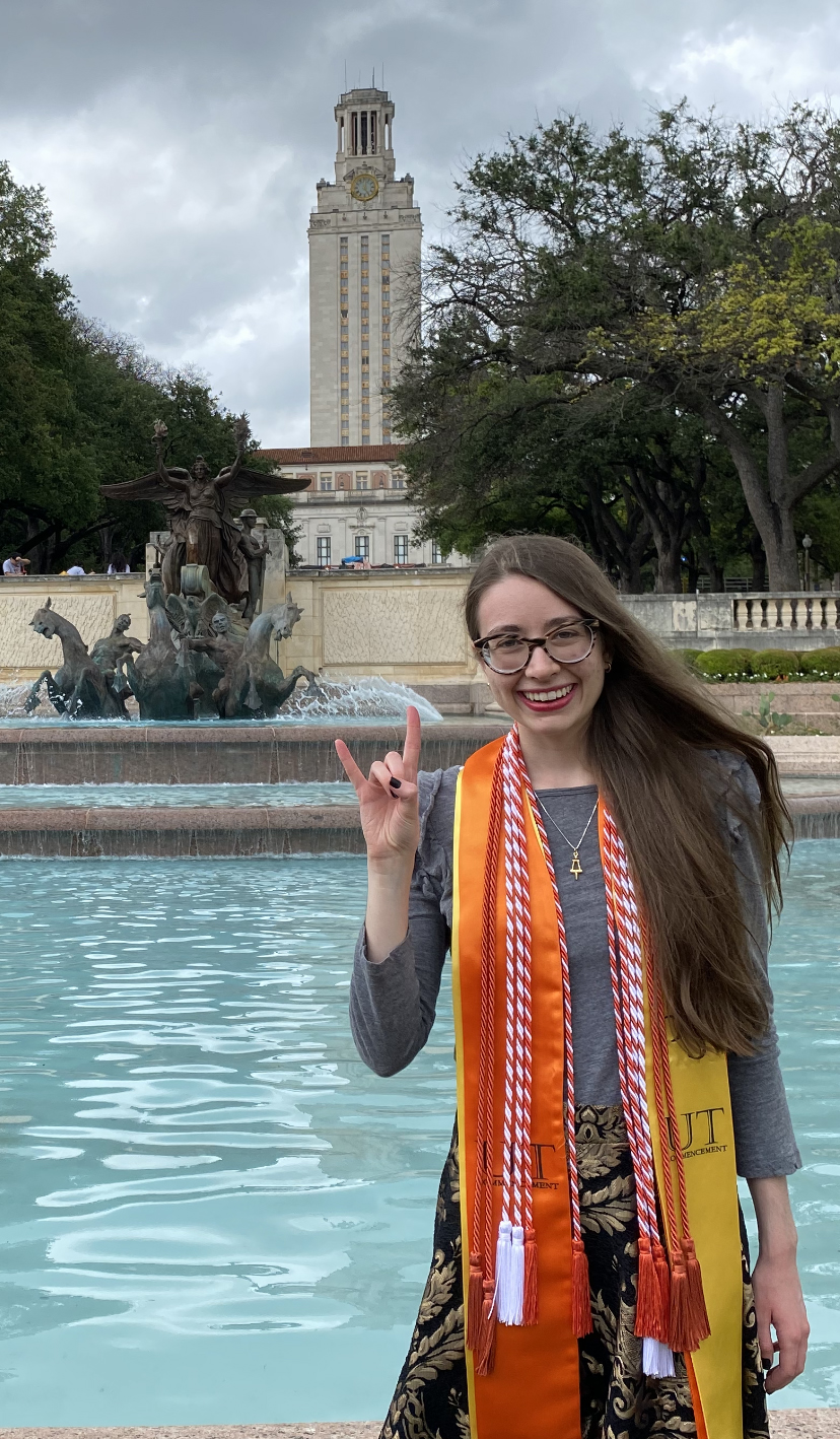 photo of katharine fisher in fountain for graduation