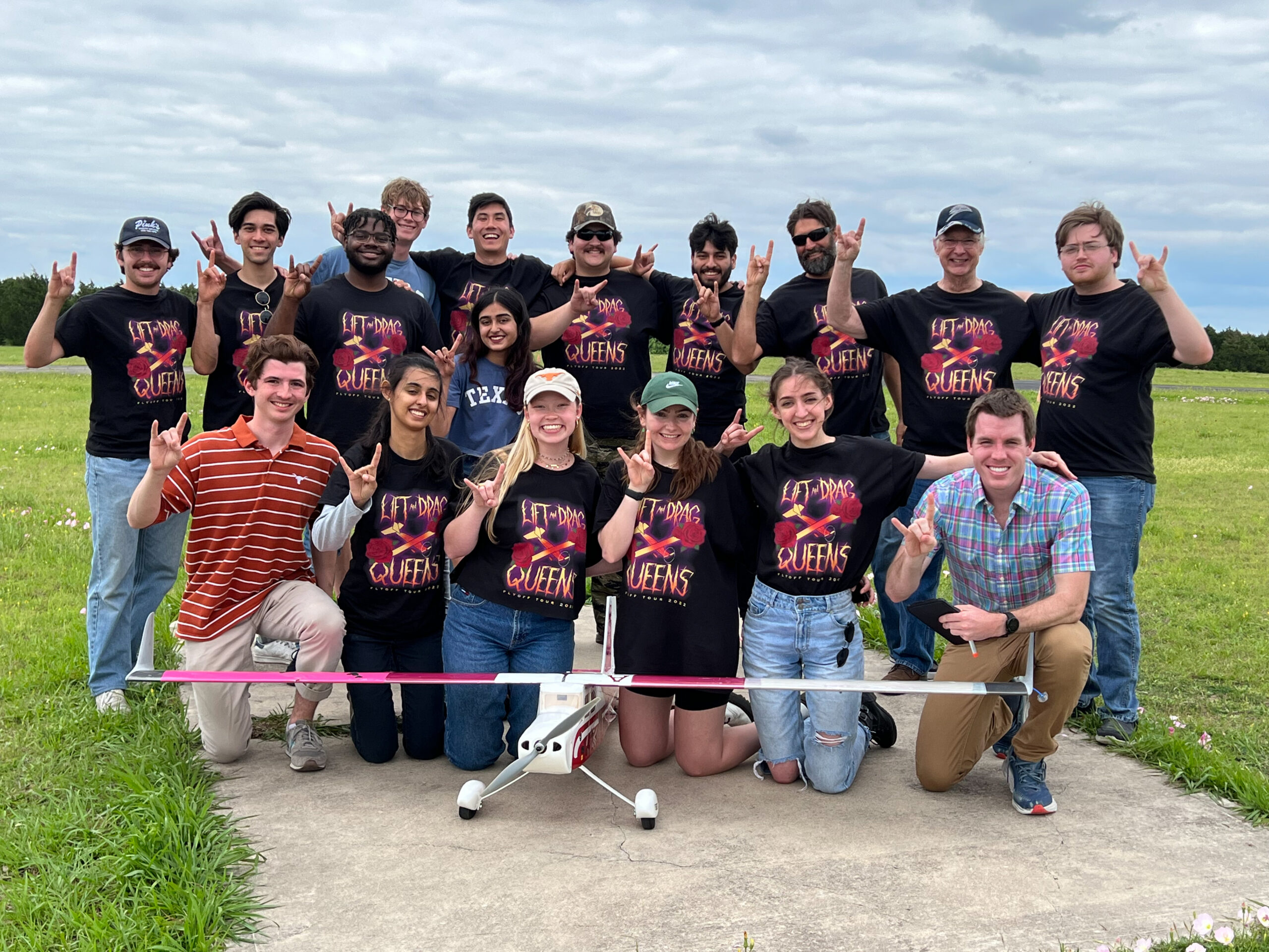 team photo of lift and drag queens aircraft design team with airplane
