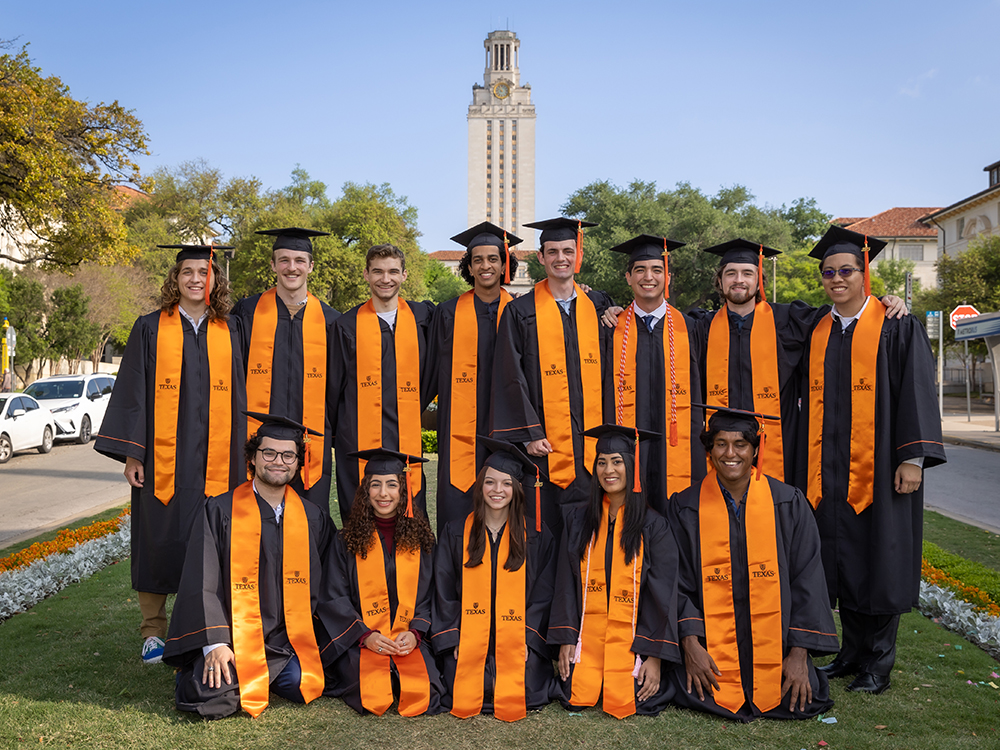class of 2023 graduation group photo in front of tower