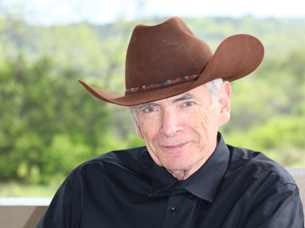 J. Tinsley Oden wearing cowboy hat and smiling.