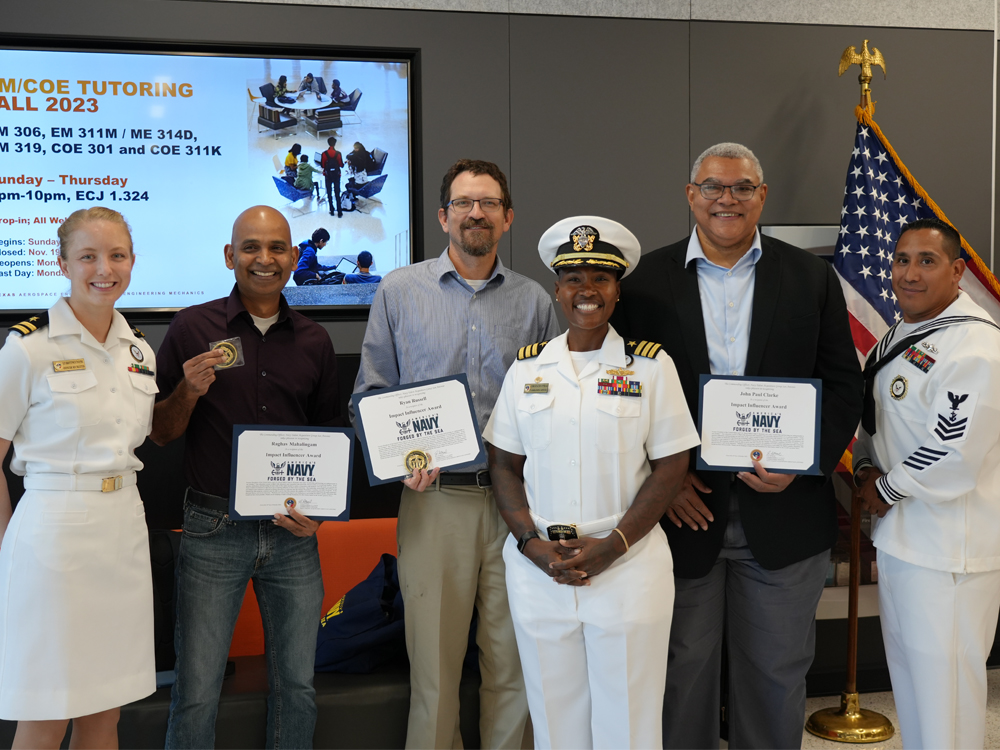 group photo of faculty members receiving Navy impact awards