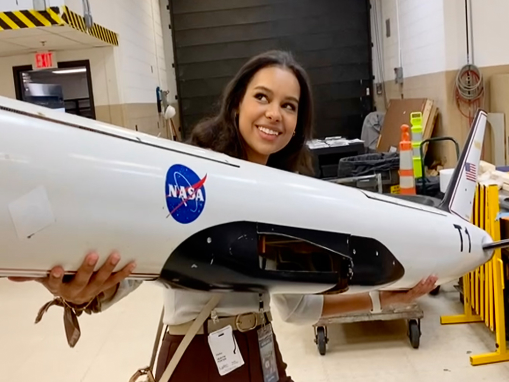 Heavyn Porter holding model of NASA aircraft wing