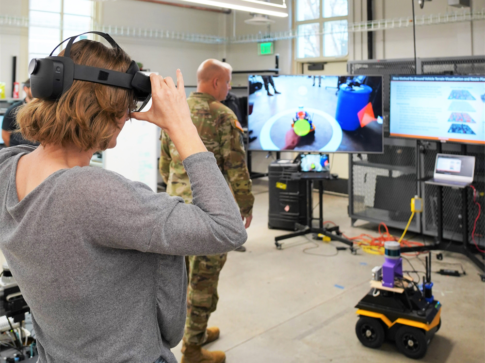 woman using virtual robotics system in lab