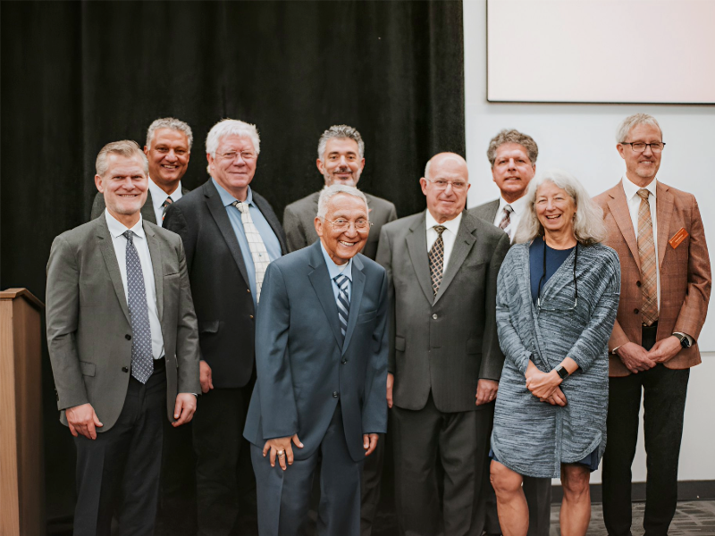 2026 Academy of Distinguished Alumni honorees smiling together with department chair Clint Dawson.