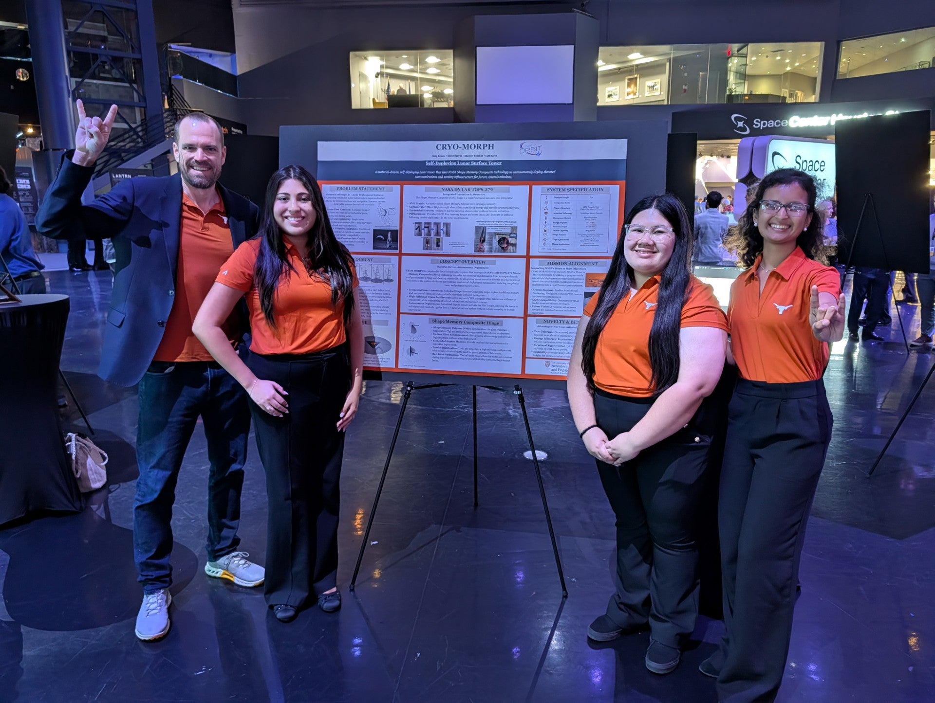 Students smiling next to CRYO MORPH poster