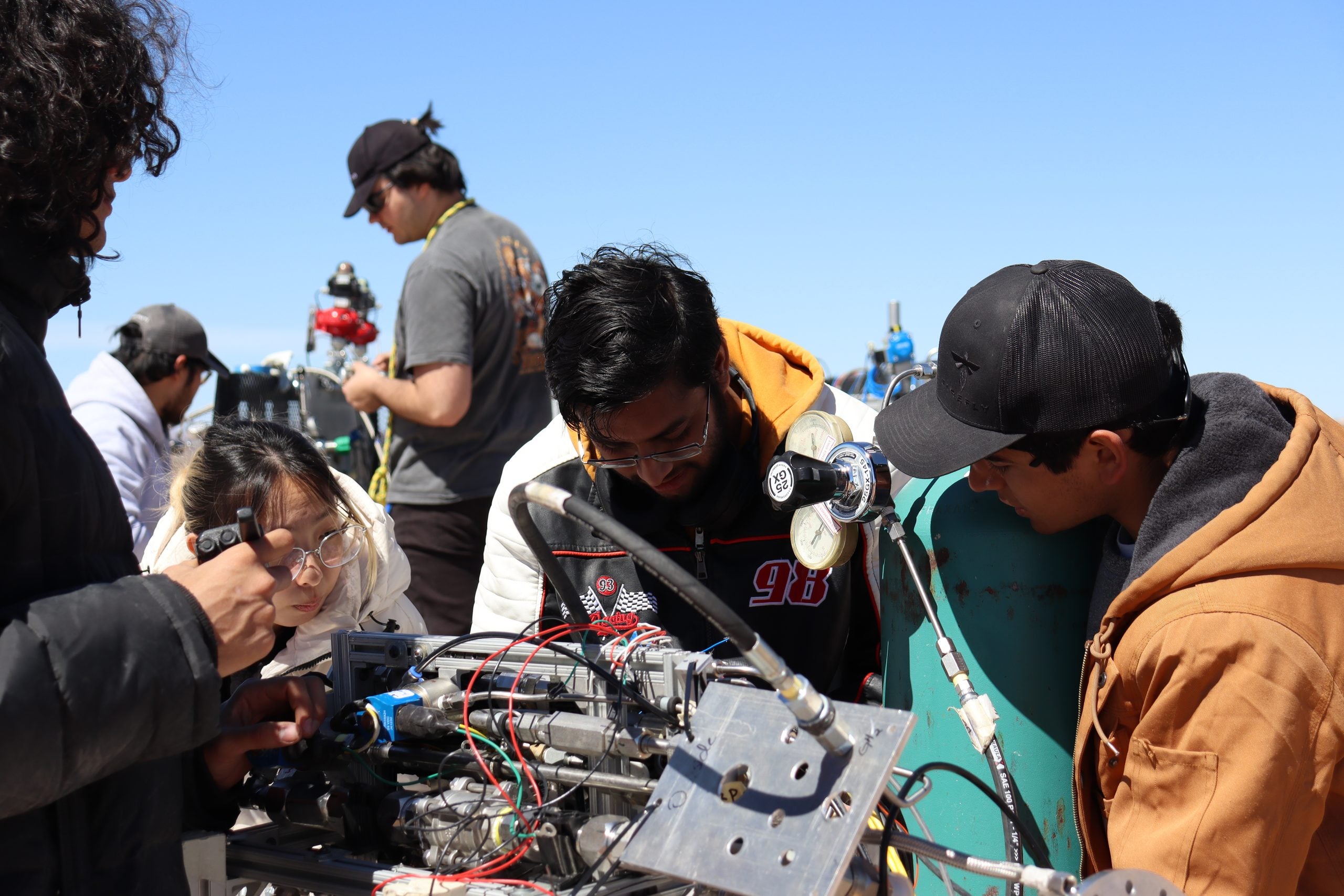 TREL students working on rocket